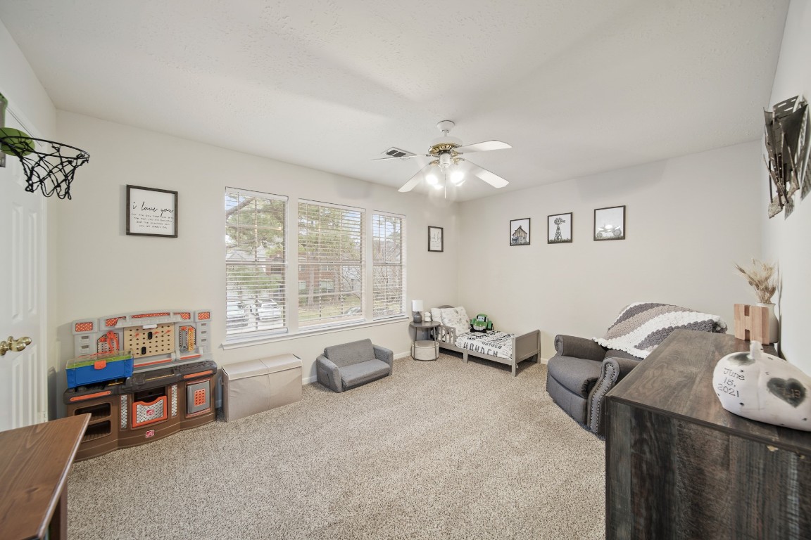16114 Kintyre Point Road Houston, TX 77095 - Photo 34 of 41 a living room with furniture and a window
