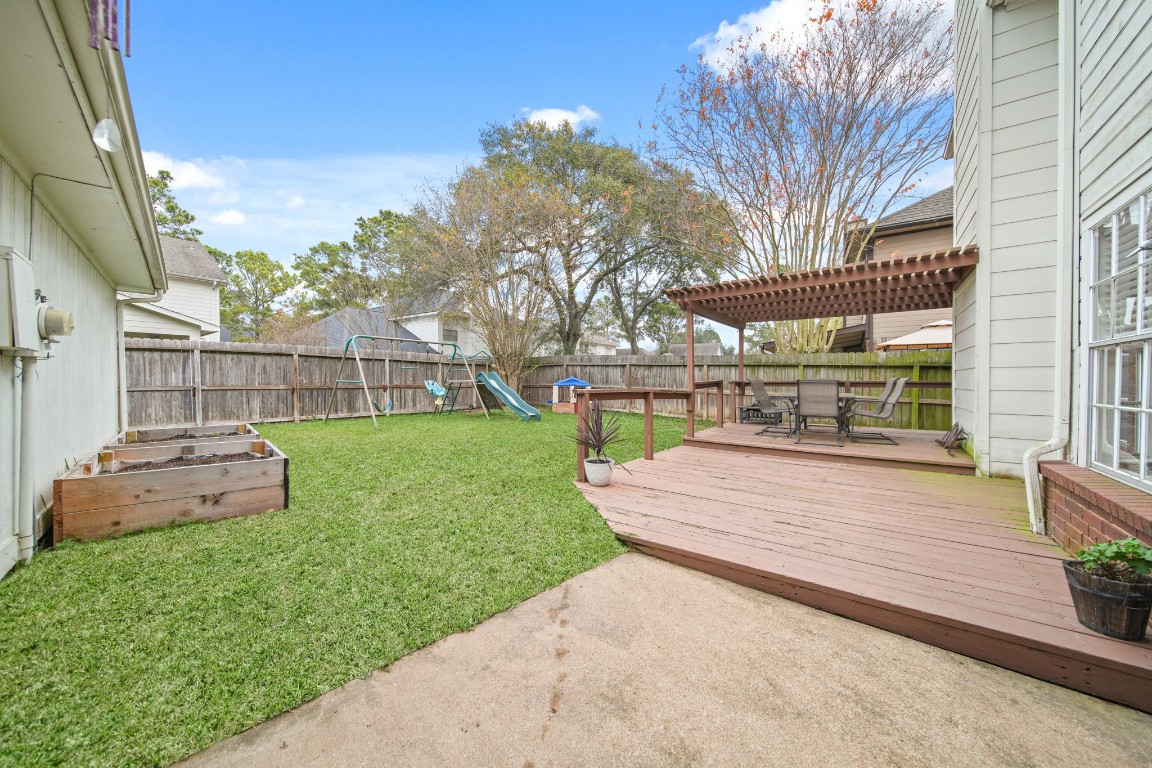 16114 Kintyre Point Road Houston, TX 77095 - Photo 37 of 41 a view of a yard with table and chairs and potted plants