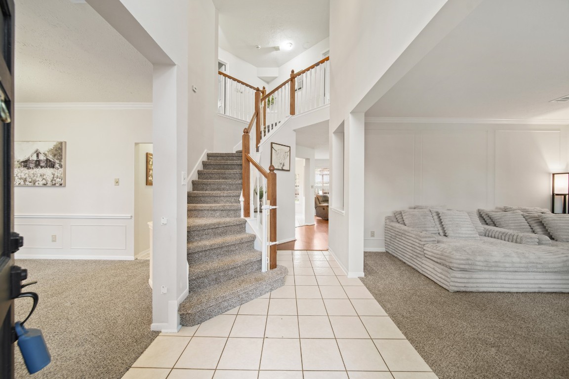 16114 Kintyre Point Road Houston, TX 77095 - Photo 6 of 41 a living room with furniture and a rug