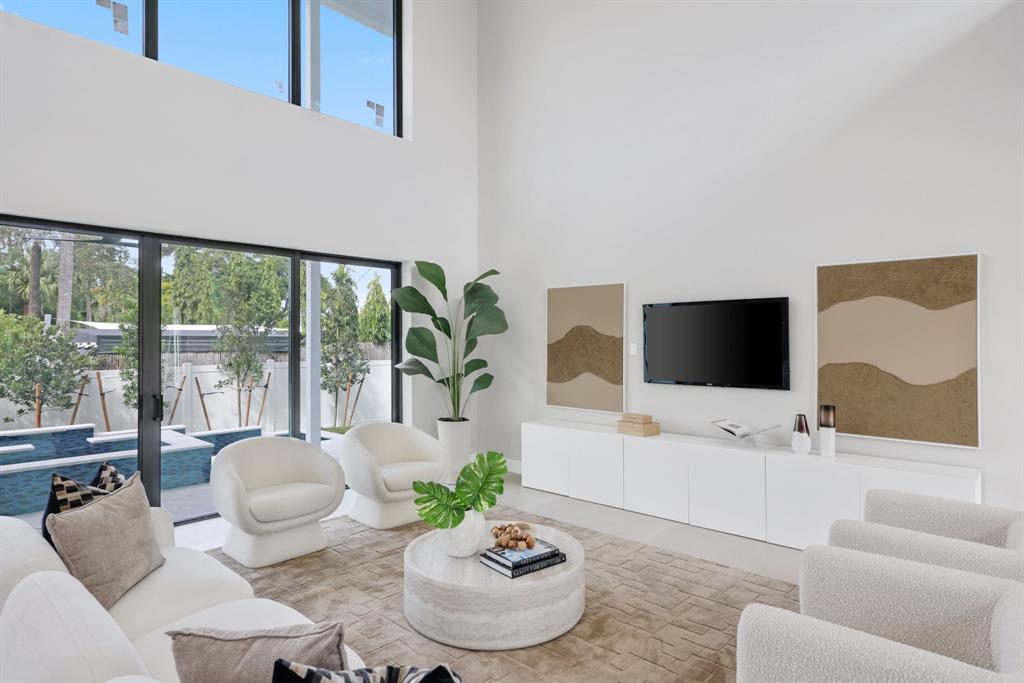 2015 Northeast 4th Avenue Wilton Manors, FL 33305 - Photo 17 of 79 a living room with furniture and a flat screen tv