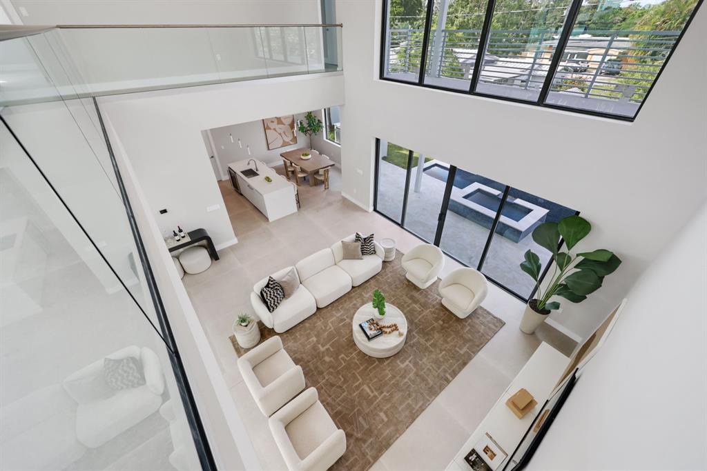 2015 Northeast 4th Avenue Wilton Manors, FL 33305 - Photo 43 of 79 a view of table and chairs in living room