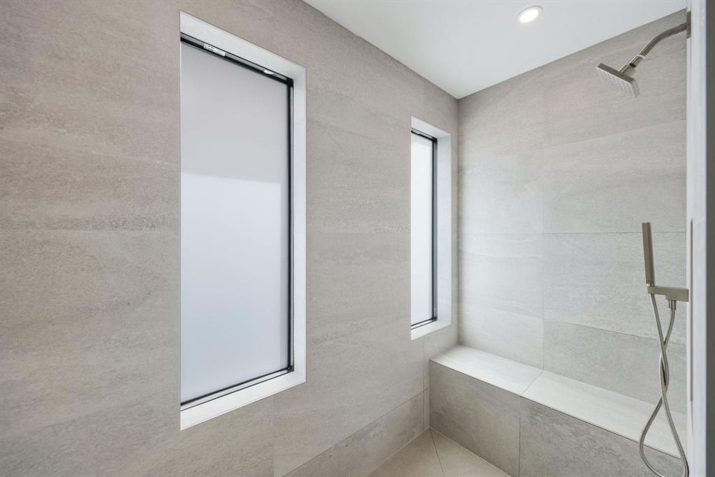 2015 Northeast 4th Avenue Wilton Manors, FL 33305 - Photo 49 of 79 a bathroom with a bathtub and shower