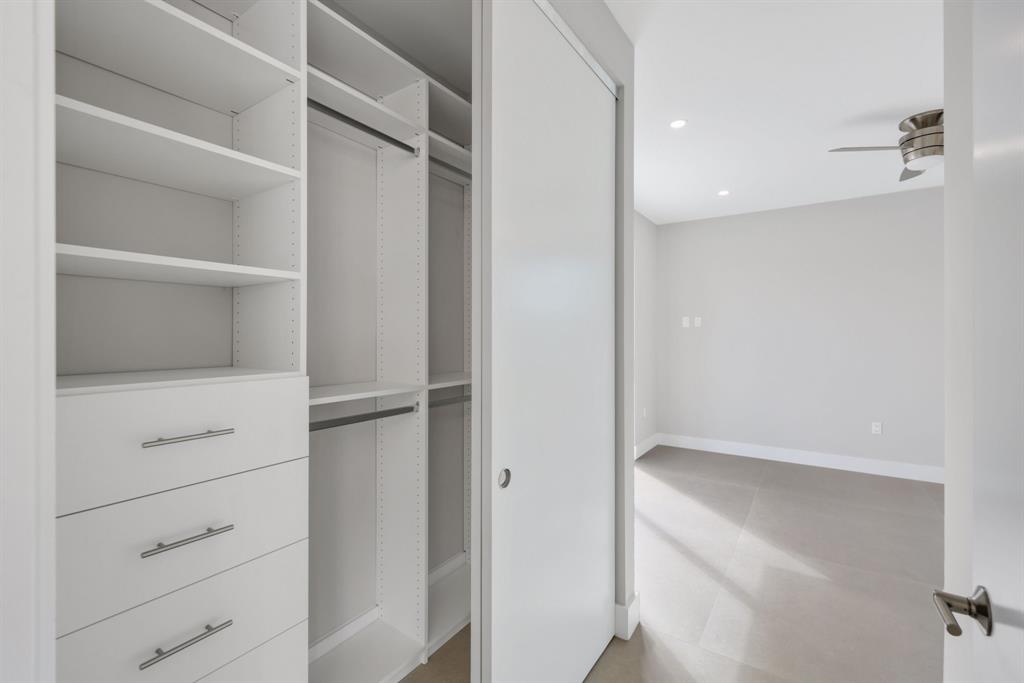 2015 Northeast 4th Avenue Wilton Manors, FL 33305 - Photo 53 of 79 a view of walk in closet with empty racks