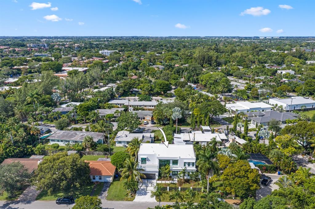 2015 Northeast 4th Avenue Wilton Manors, FL 33305 - Photo 72 of 79 an aerial view of residential houses with outdoor space and trees