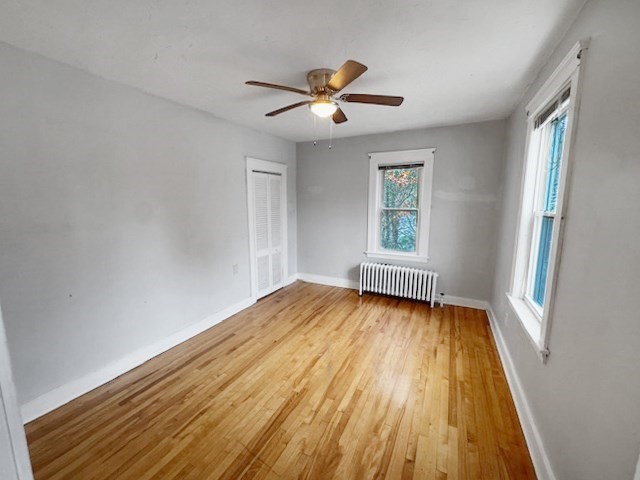 80 Delmont Avenue Worcester, MA 01604 - Photo 28 of 35 a view of empty room with wooden floor and fan