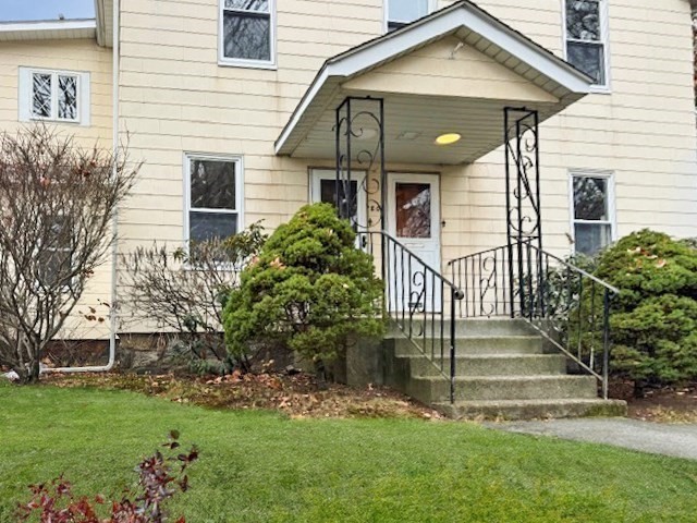 80 Delmont Avenue Worcester, MA 01604 - Photo 3 of 35 a front view of a house with a yard