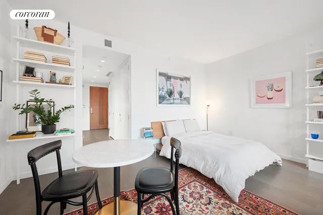 a living room with furniture and a rug