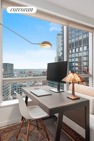 a bedroom with a bed and a table in it