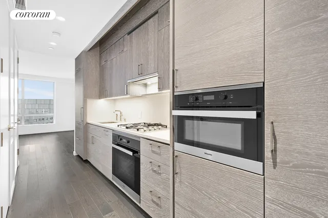 a view of a workspace with a table and chair