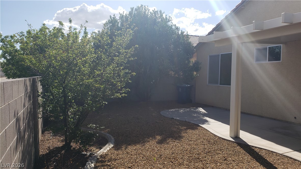9112 Manalang Road Las Vegas, NV 89123 - Photo 12 of 50 A private yard with mature landscaping offers a serene outdoor retreat.