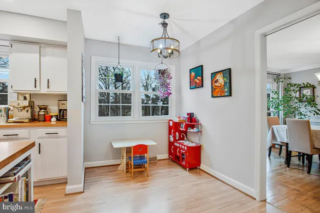 a open kitchen with stainless steel appliances granite countertop a refrigerator and a stove top oven