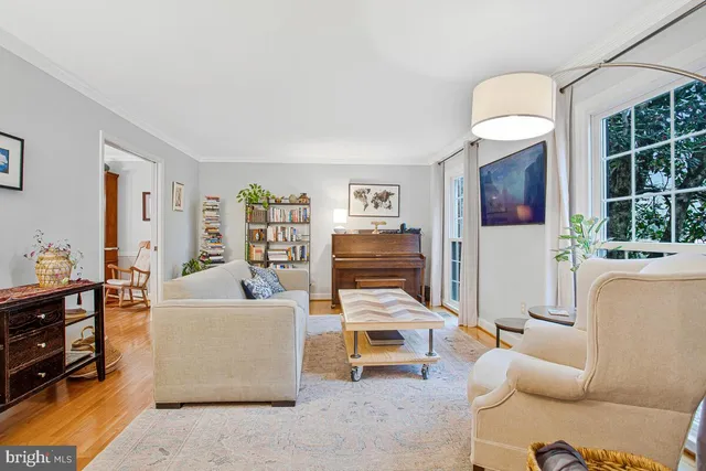 a bedroom with furniture and a book shelf