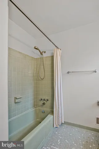 a living room with furniture rug and window