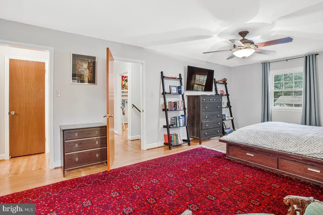 a bathroom with a window and a shower
