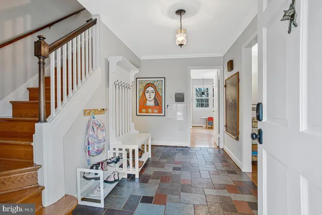 a view of an entryway with wooden floor