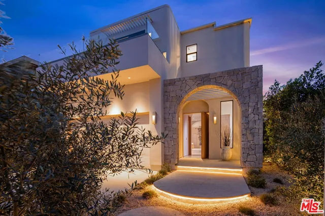 an entrance to house with yard