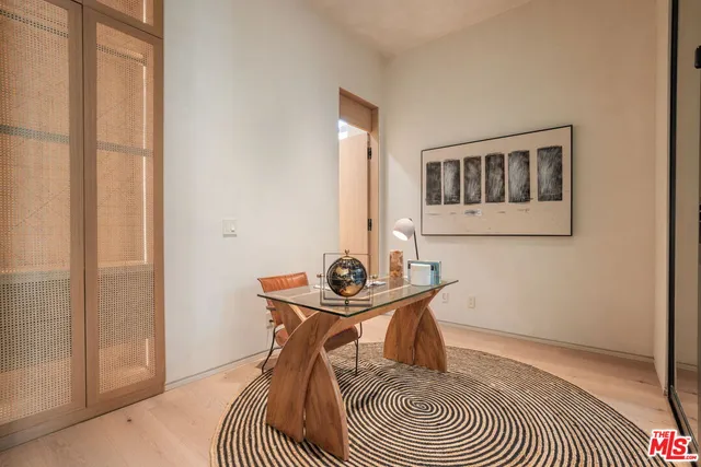 a room with stainless steel appliances a sink and stove