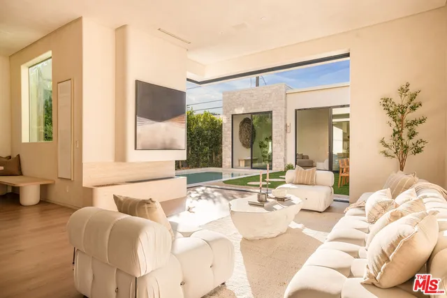 a spacious bedroom with a bed and a couch