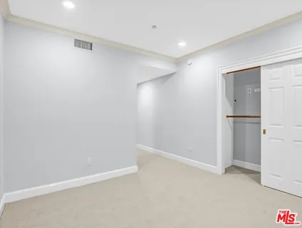 a view of storage and utility room with washer and dryer