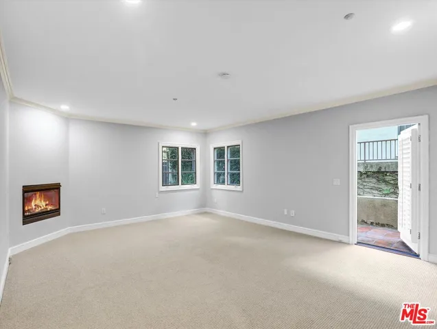 a bathroom with a granite countertop sink mirror vanity and toilet