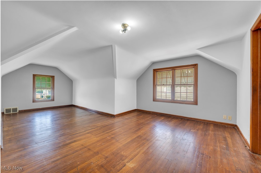 5817 Turney Road Garfield Heights, OH 44125 - Photo 19 of 31 Bonus room with plenty of natural light, lofted ceiling, and wood-type flooring