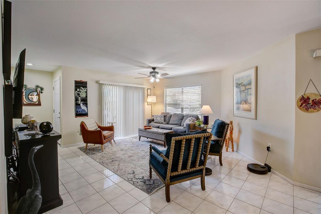 103 Cypress Pond Road, Unit 103 Palm Harbor, FL 34683 - Photo 21 of 52 a view of a livingroom with furniture and a window