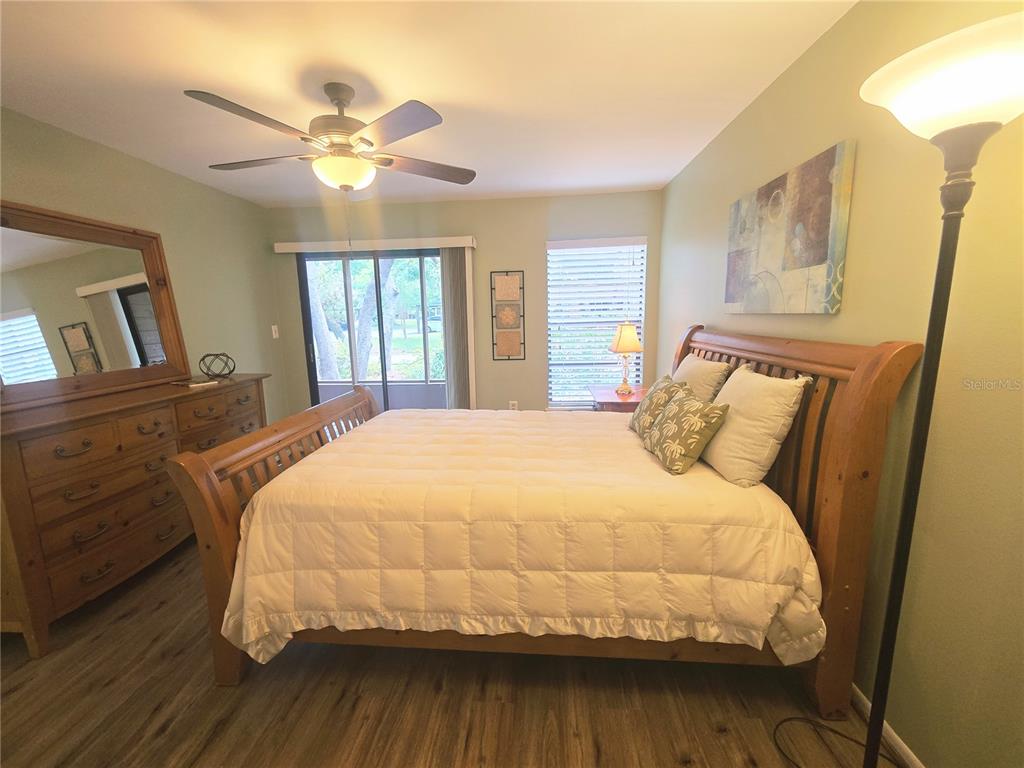103 Cypress Pond Road, Unit 103 Palm Harbor, FL 34683 - Photo 30 of 52 a large bed sitting in a bedroom next to a window
