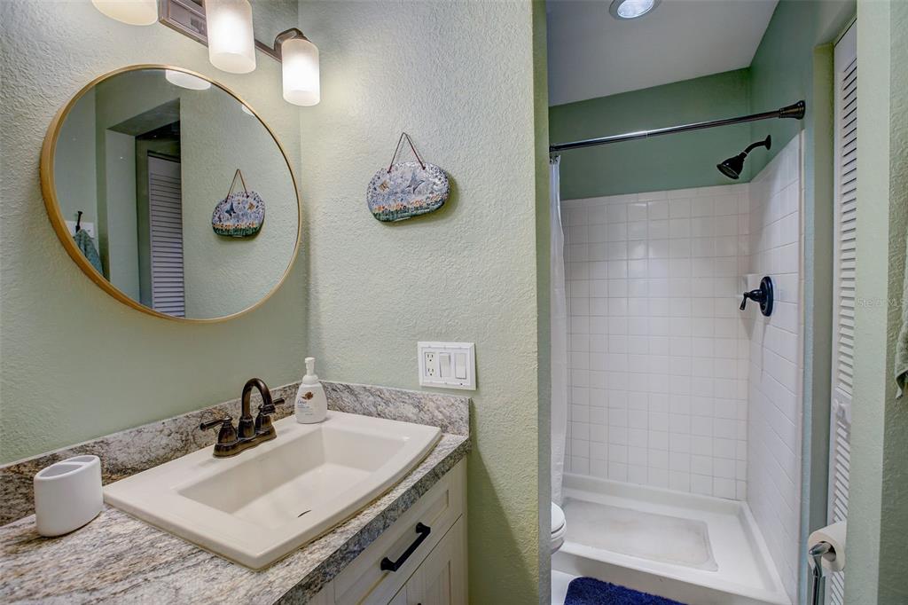 103 Cypress Pond Road, Unit 103 Palm Harbor, FL 34683 - Photo 33 of 52 a bathroom with a sink and a mirror