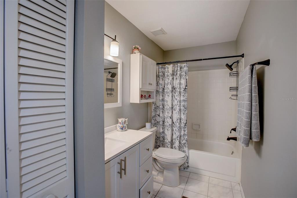 103 Cypress Pond Road, Unit 103 Palm Harbor, FL 34683 - Photo 36 of 52 a bathroom with a sink a toilet and shower