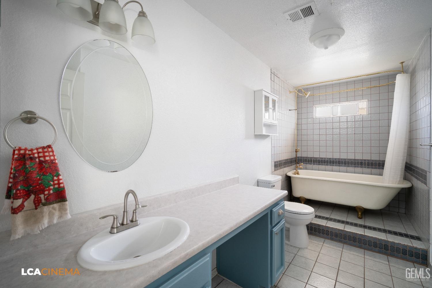 Undisclosed Address Bakersfield, CA 93305 - Photo 12 of 20 a bathroom with a sink and a mirror