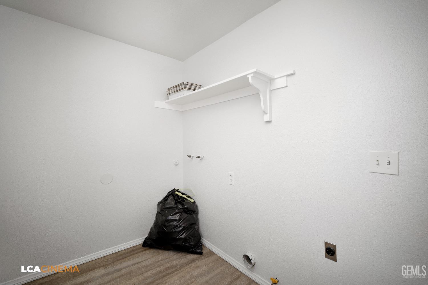 Undisclosed Address Bakersfield, CA 93305 - Photo 14 of 20 a view of a room with rack on the wall