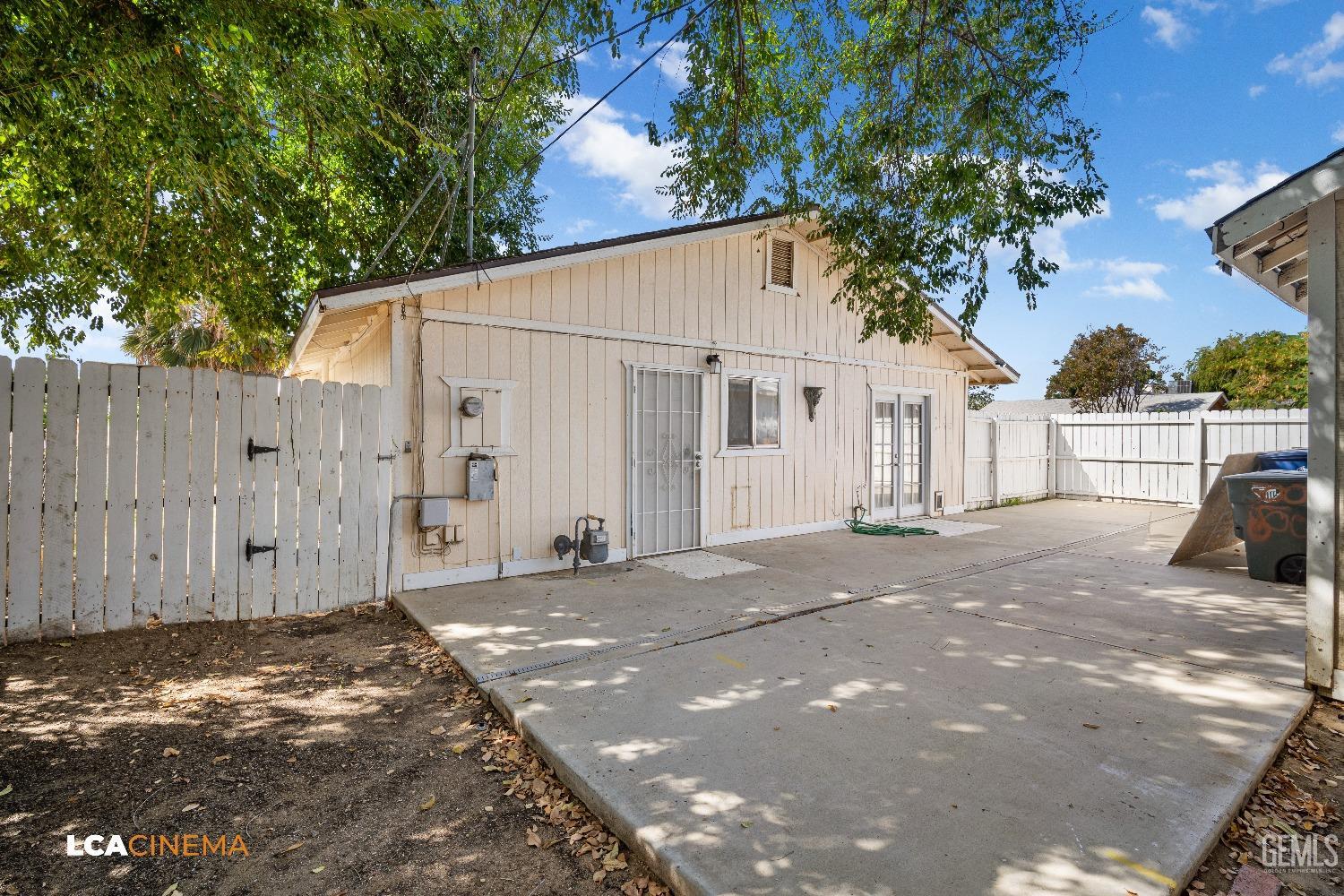 Undisclosed Address Bakersfield, CA 93305 - Photo 16 of 20 a view of a house with a backyard