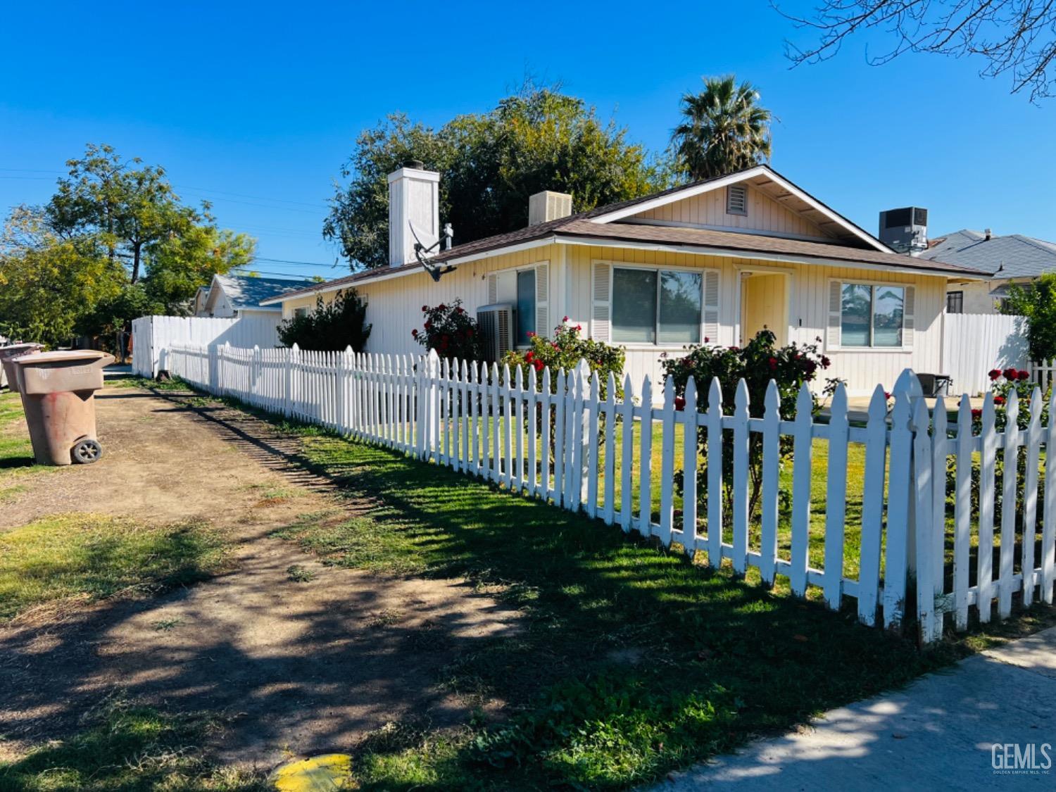 Undisclosed Address Bakersfield, CA 93305 - Photo 18 of 20 a front view of house with a garden