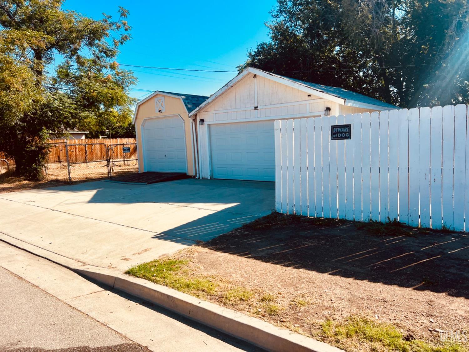 Undisclosed Address Bakersfield, CA 93305 - Photo 20 of 20 a front view of a house with a yard