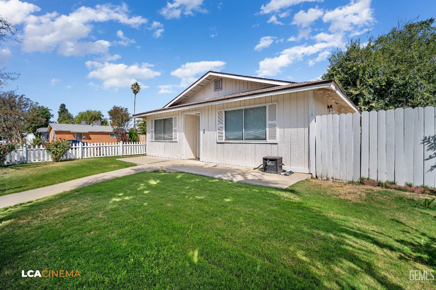 Undisclosed Address Bakersfield, CA 93305 - Photo 3 of 20 a backyard of a house with table and chairs