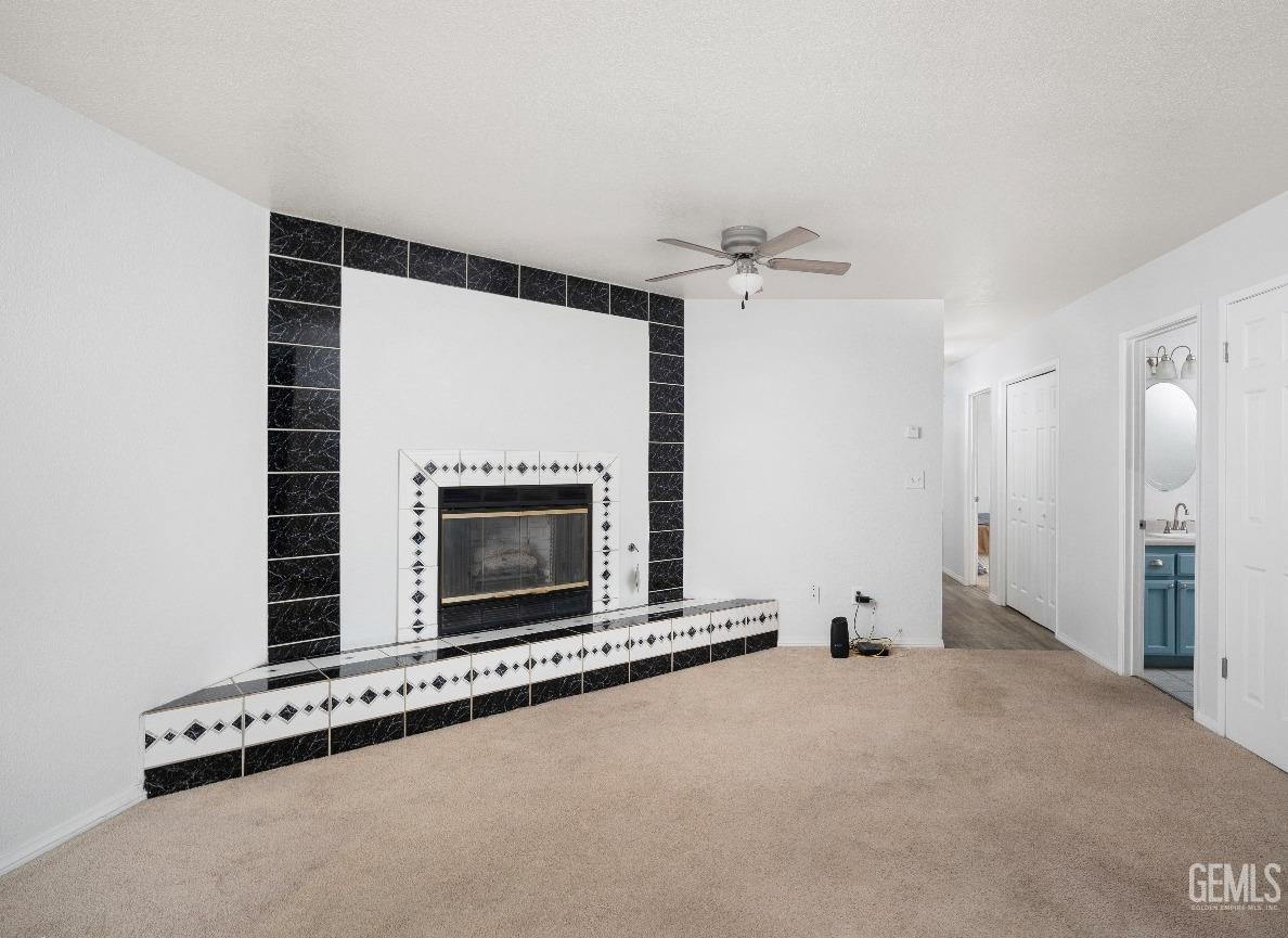 Undisclosed Address Bakersfield, CA 93305 - Photo 4 of 20 a view of an empty room with fire place