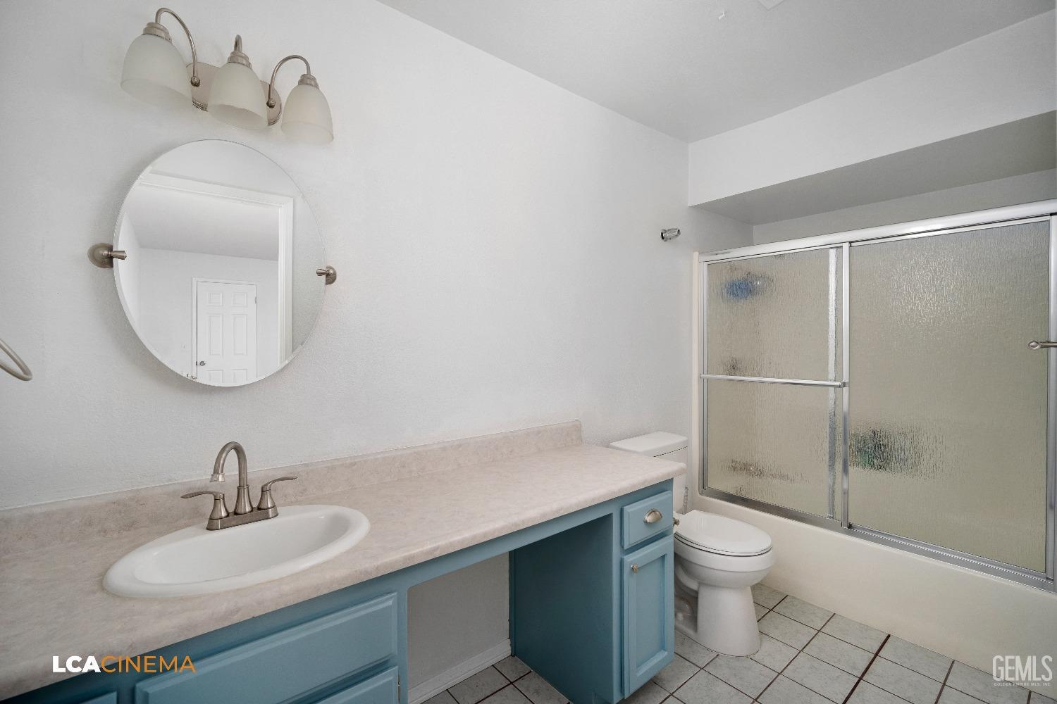 Undisclosed Address Bakersfield, CA 93305 - Photo 10 of 20 a bathroom with a sink toilet and shower