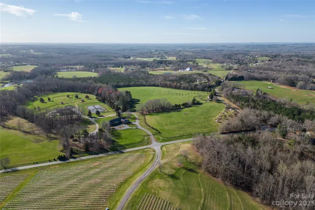 an aerial view of a house with a garden
