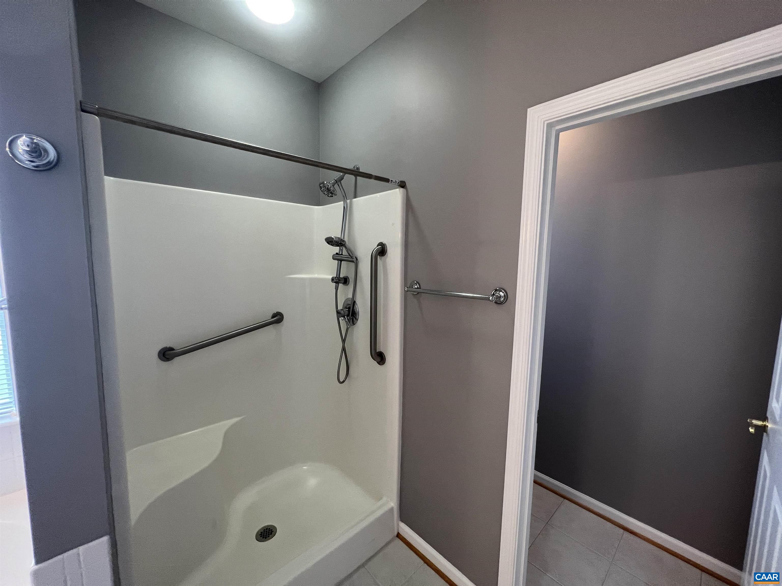 5357 Windy Ridge Road Charlottesville, VA 22903 - Photo 21 of 46 a bathroom with a glass shower door and a sink