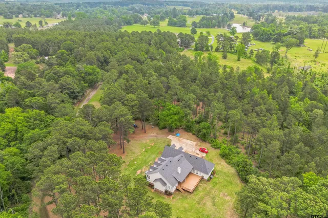 a aerial view of a house with a yard
