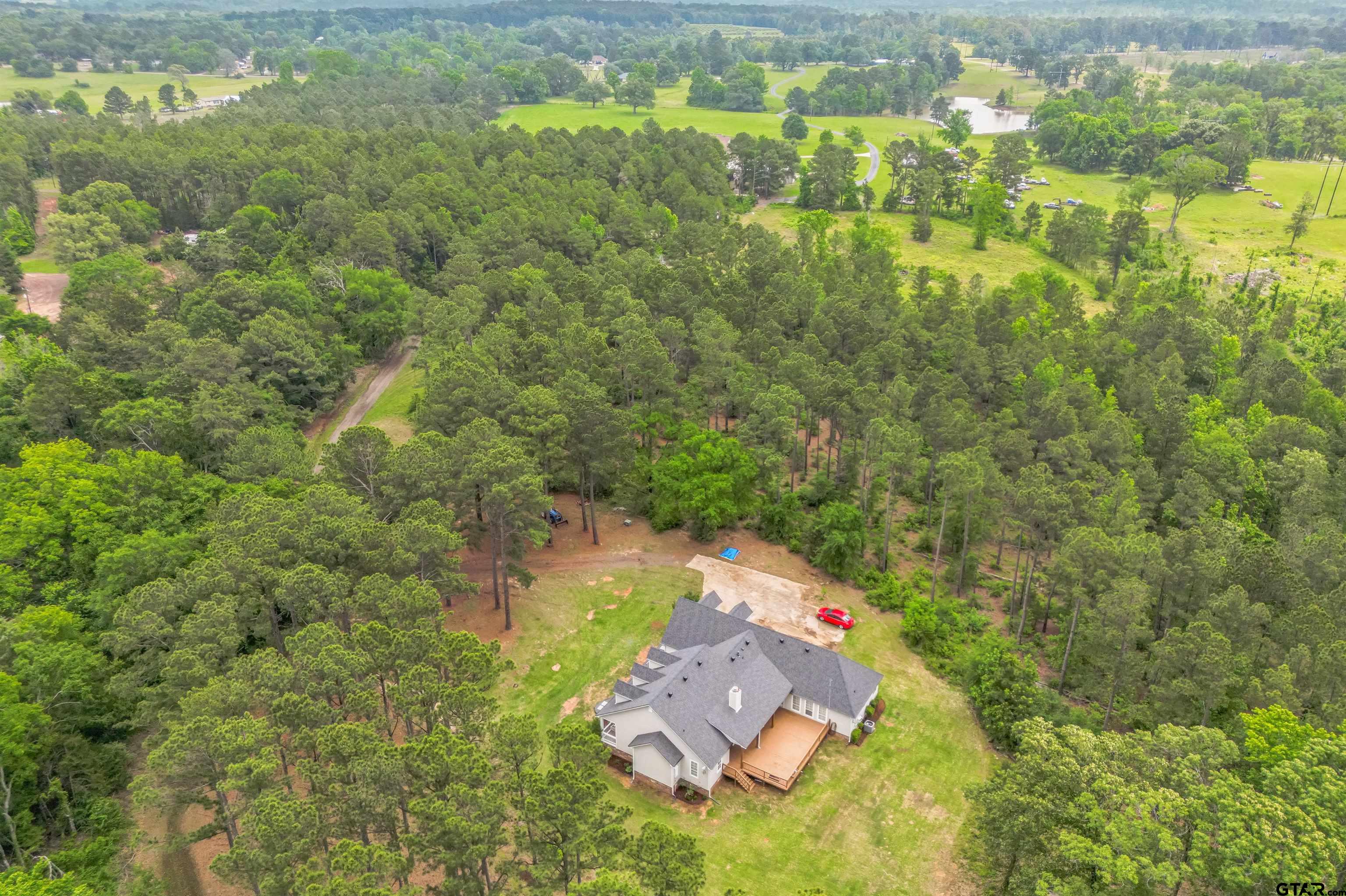 a aerial view of a house with a yard