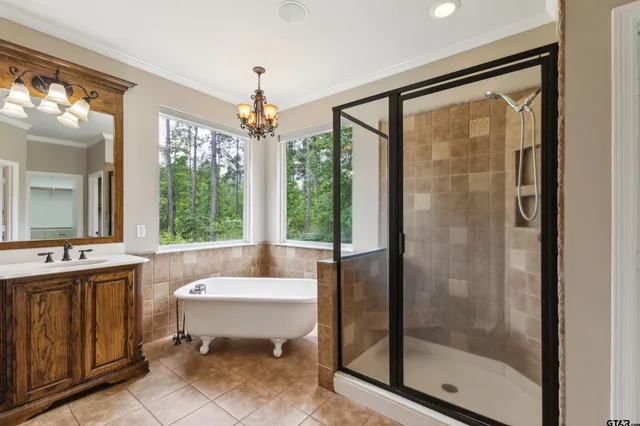 a spacious bathroom with a shower and a bathtub