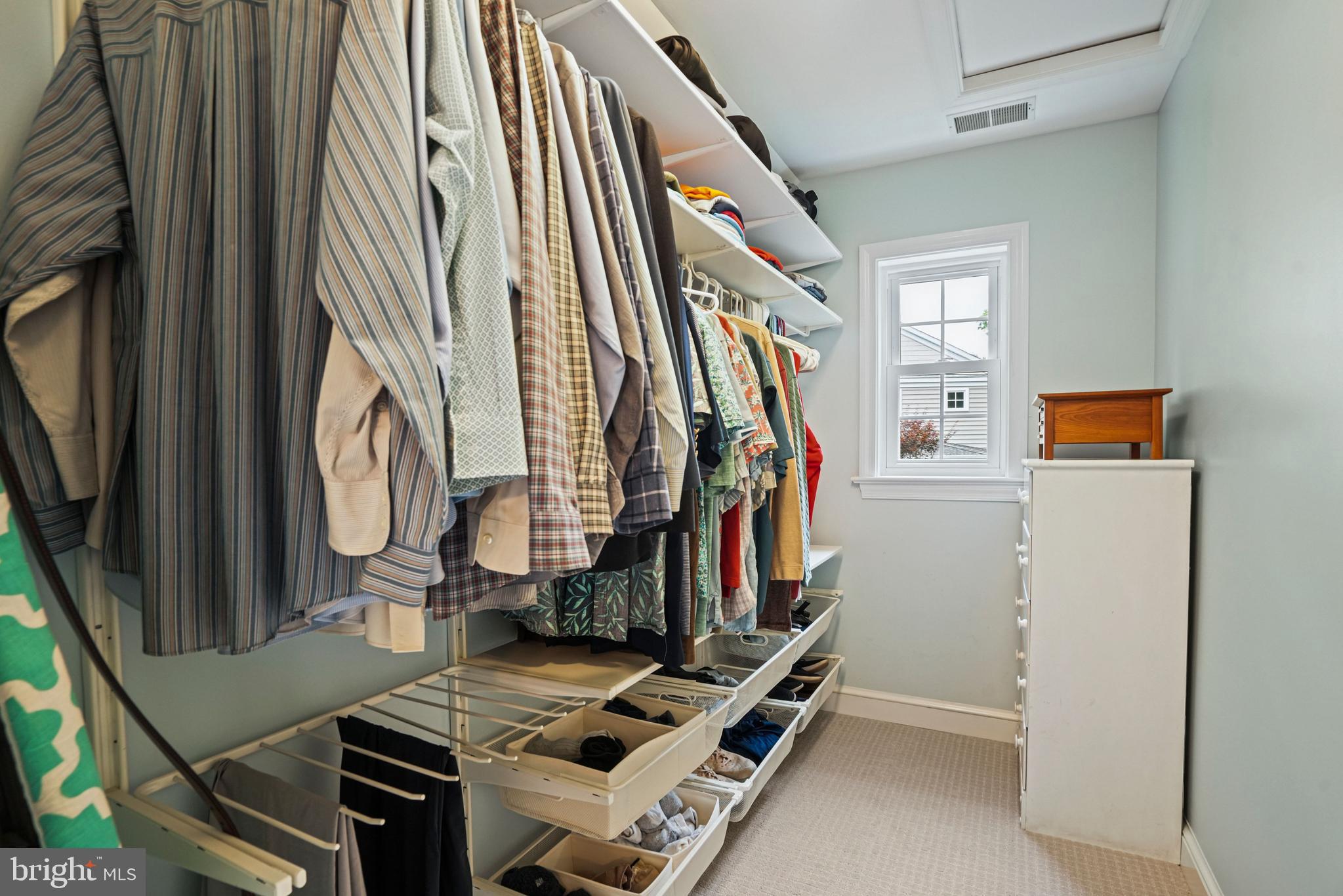 1907 Brisbane Street Silver Spring, MD 20902 - Photo 22 of 39 a view of walk in closet with clothes and shoes