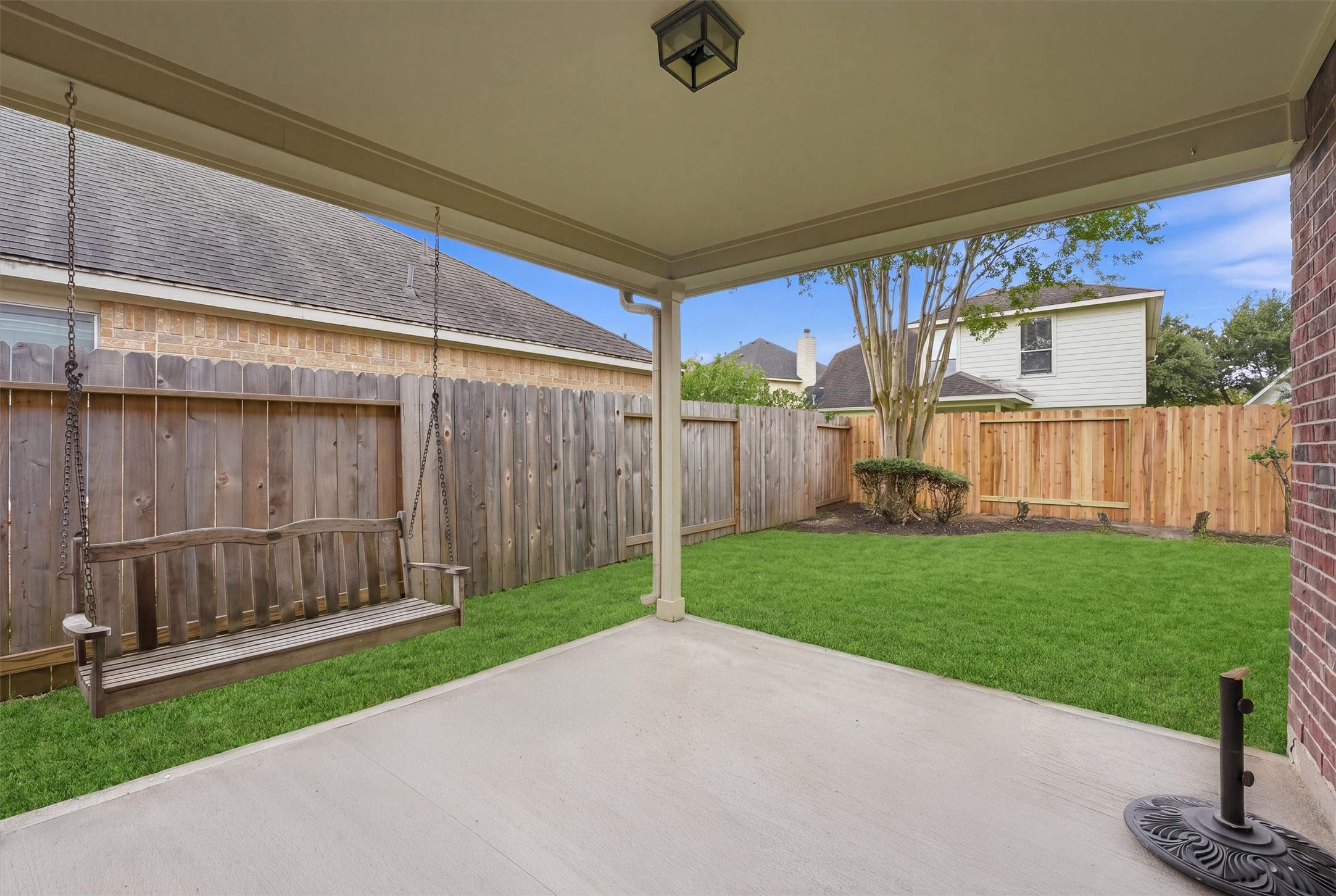 20931 Hamlet Ridge Lane Katy, TX 77449 - Photo 13 of 23 Generous covered patio perfect for outdoor gatherings complete with swing.
