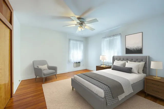 a bedroom with a bed and chair