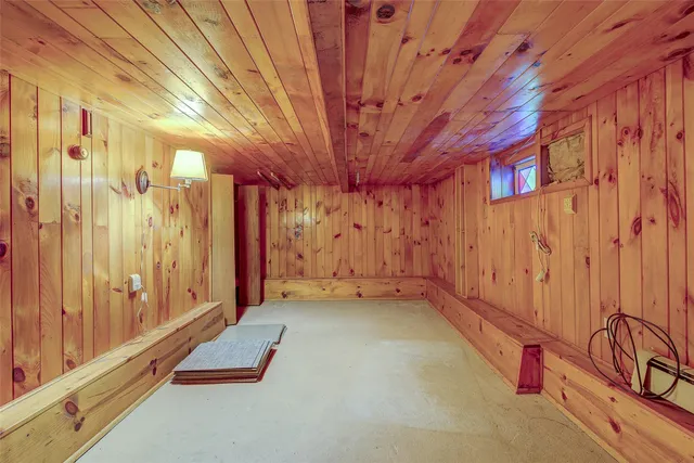 a view of a room with wooden walls