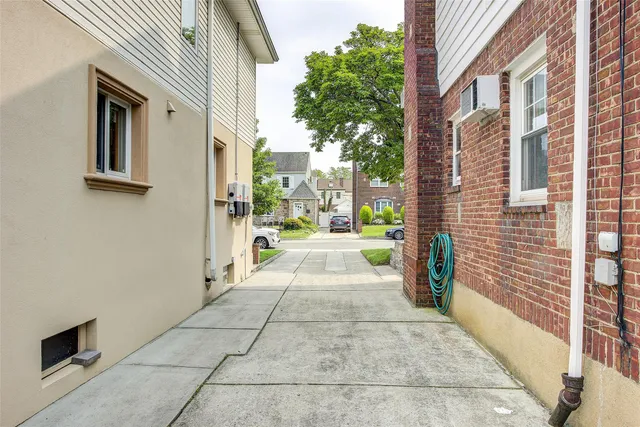 a view of a big yard with a fountain