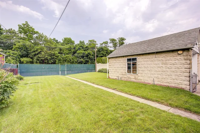 a view of a backyard with a garden and plants