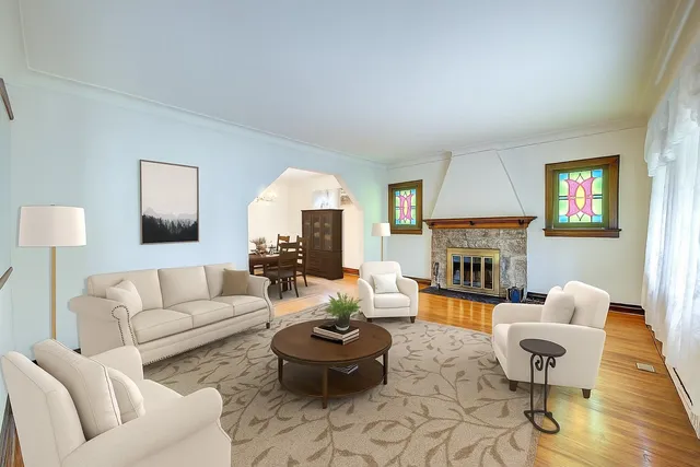 a living room with furniture and a fireplace