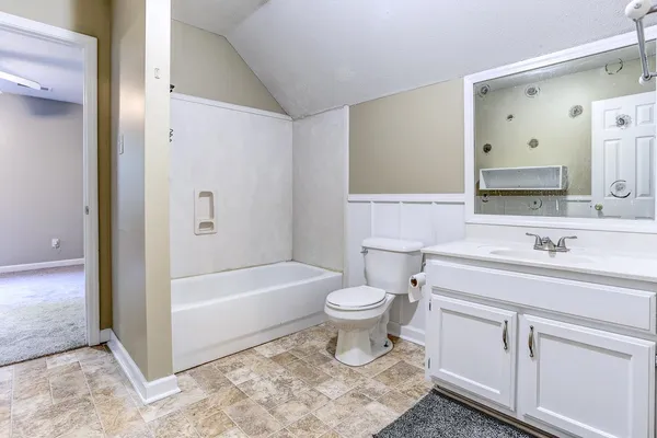 a bathroom with a sink a toilet and a bathtub